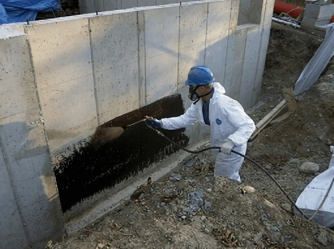 Professional waterproofing the exterior walls of the basement in Chula Vista, CA