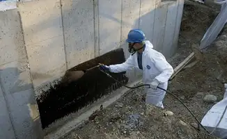 Professional waterproofing the exterior walls of the basement in Chula Vista, CA